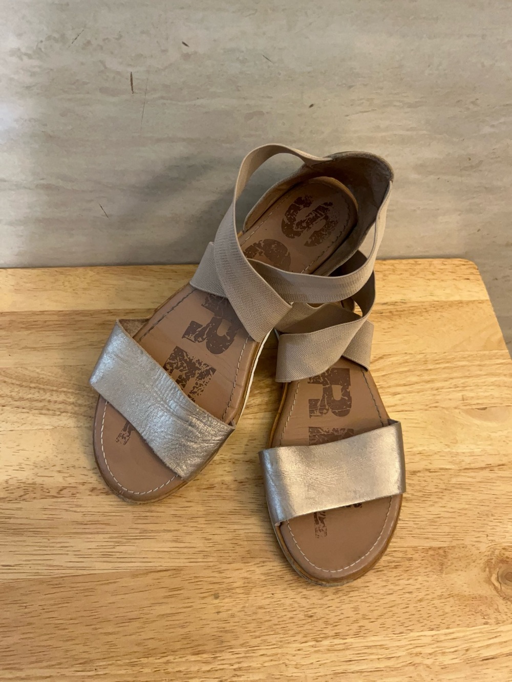 SOREL Ella II Sandal in a metallic gold/taupe colorway.